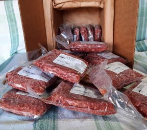 insulated shipping box with packages of ground beef